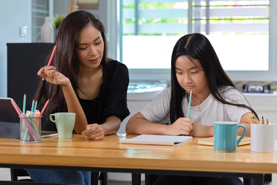 student and tutor together at a desk in Berekley