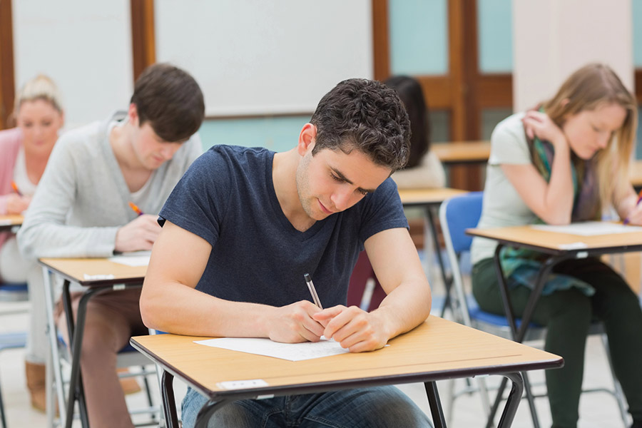 Students taking a test in a classroom in Berekley